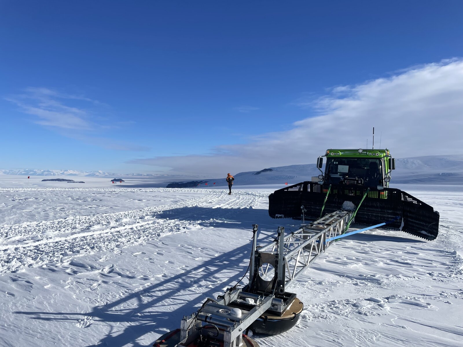 Radar
boom extending from a PistenBully blade toward the camera